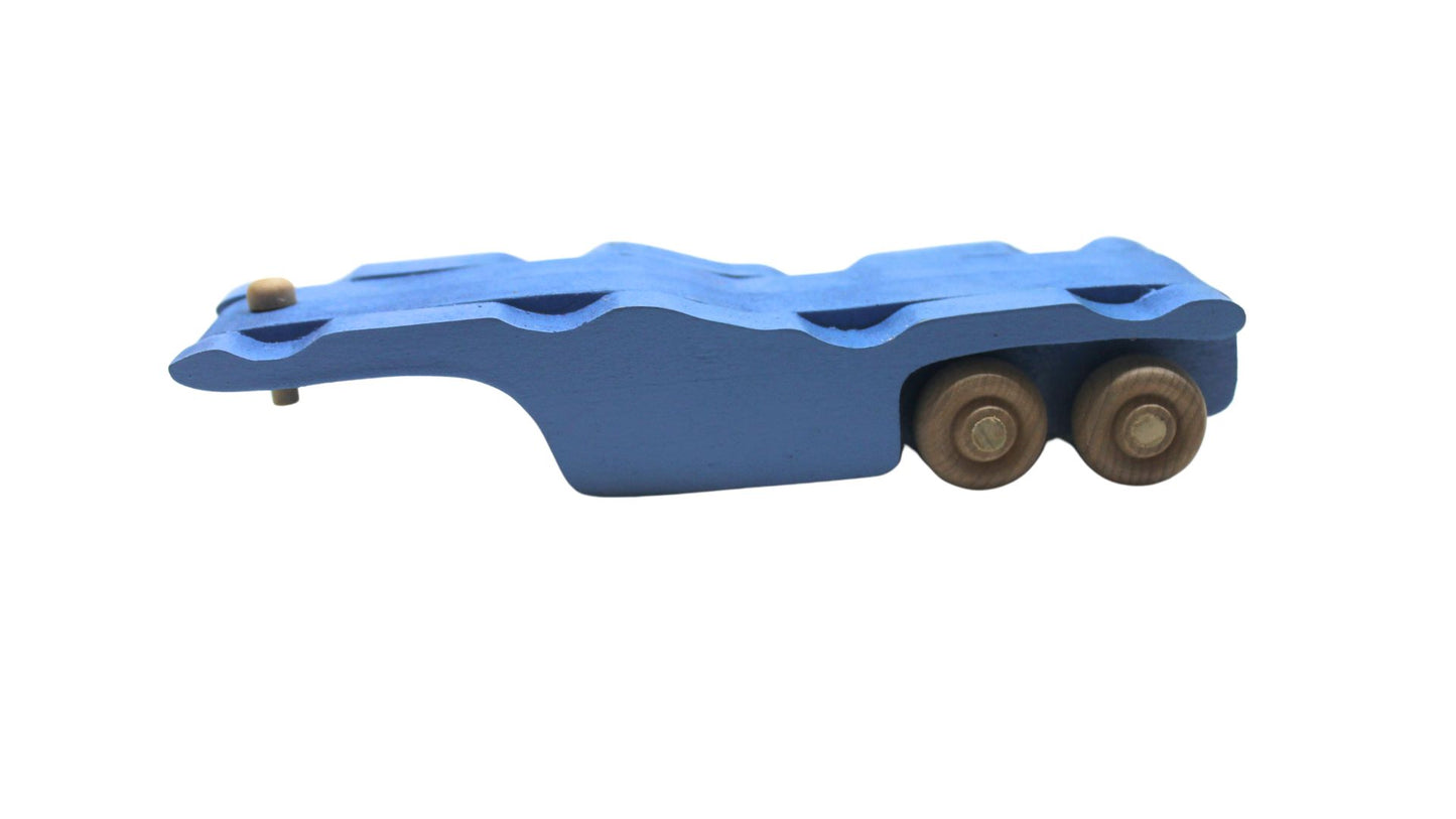 Volkswagen car carrier solid wood toy. Set includes a tractor with separate trailer, a VW bug, convertible, and van, and two people