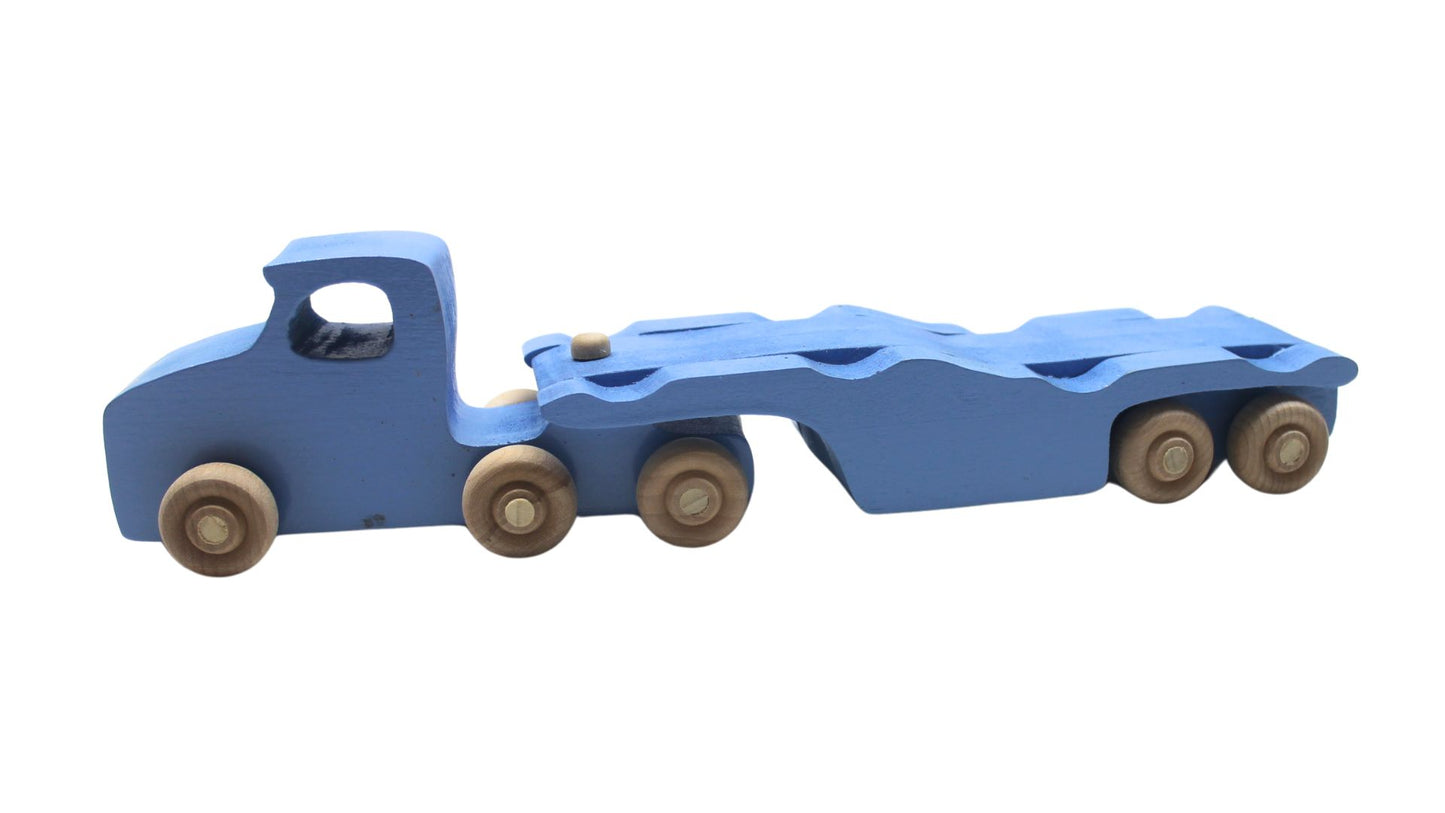 Volkswagen car carrier solid wood toy. Set includes a tractor with separate trailer, a VW bug, convertible, and van, and two people