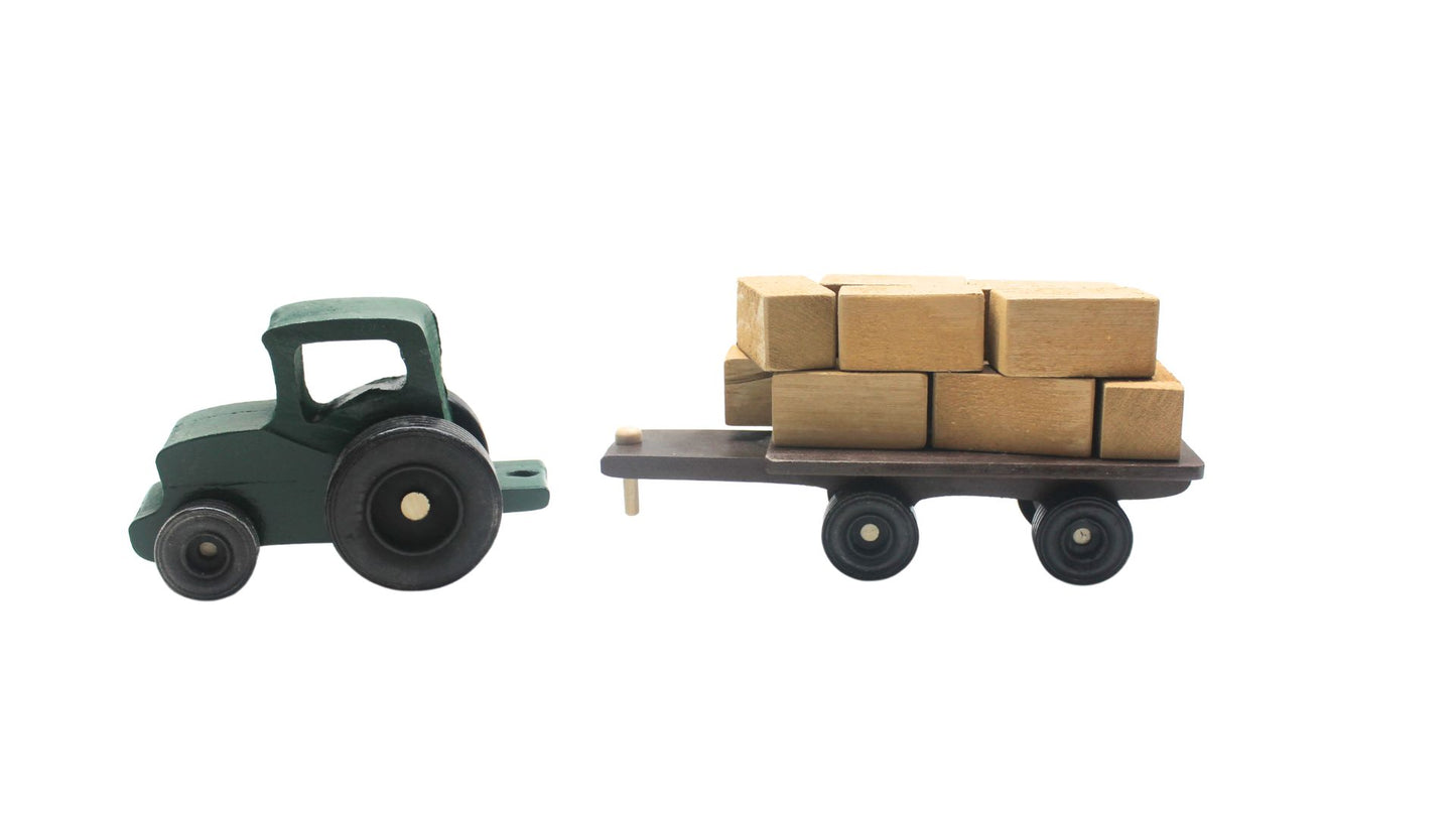 Cattle ranch play set. Includes a tractor pulling a wagon, hay bales, fence sections, cows and calves