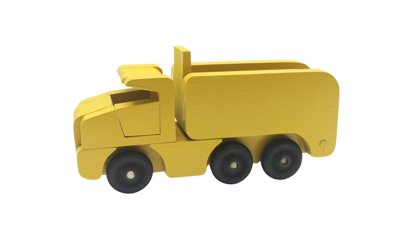 Toy wooden dump truck. What is more fun than a dump truck? Tilting bed, comes in choice of colors