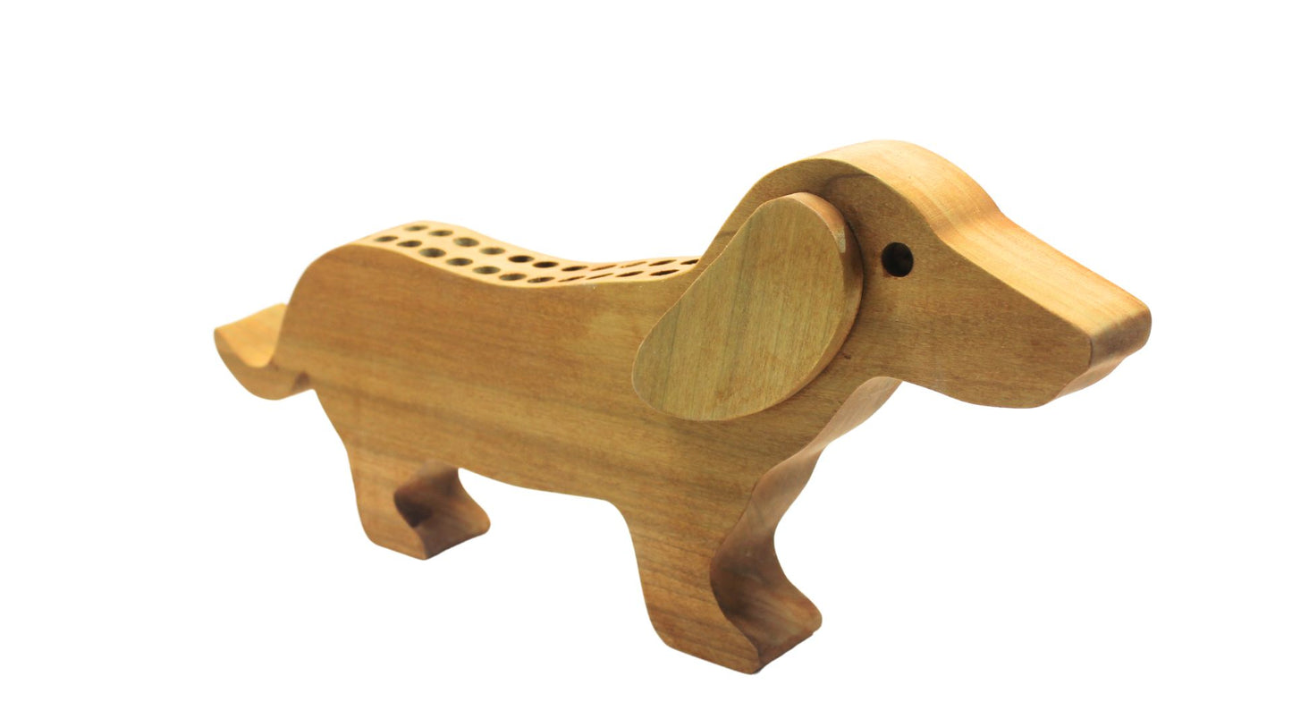 Dachshund shaped crayon holder. This cute holder provides a motivation for a child to put their crayons away