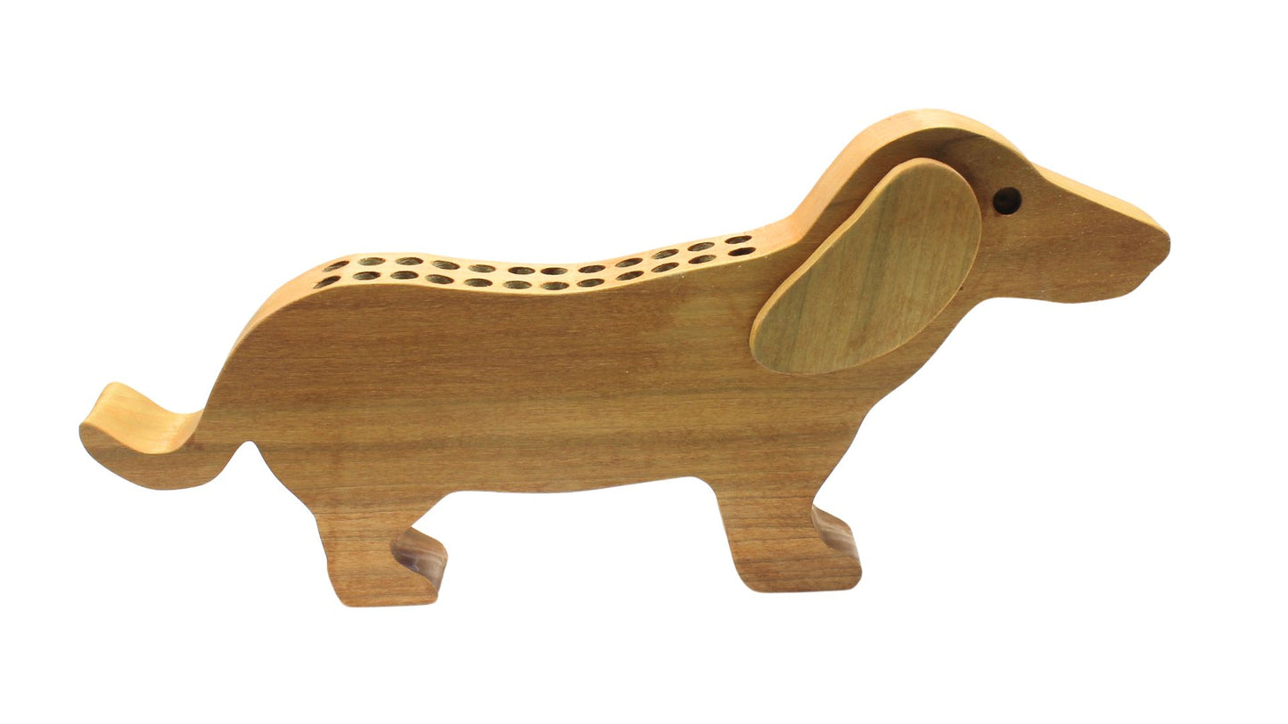 Dachshund shaped crayon holder. This cute holder provides a motivation for a child to put their crayons away