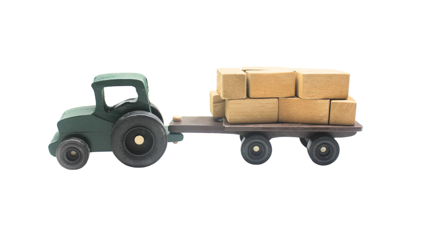 Cattle ranch play set. Includes a tractor pulling a wagon, hay bales, fence sections, cows and calves