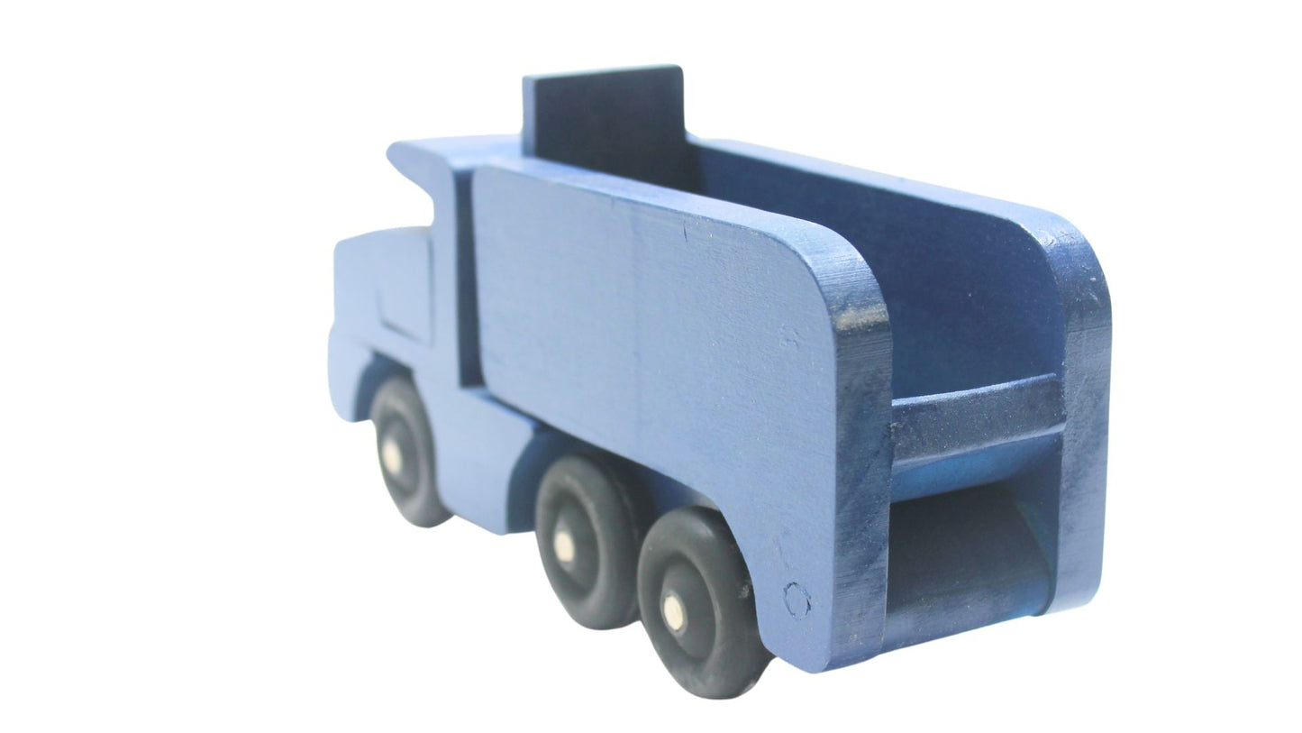 Toy wooden dump truck. What is more fun than a dump truck? Tilting bed, comes in choice of colors