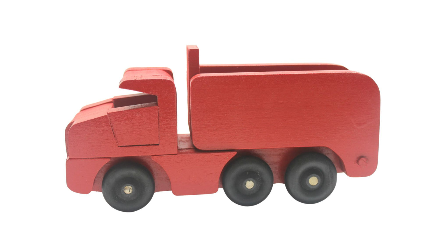 Toy wooden dump truck. What is more fun than a dump truck? Tilting bed, comes in choice of colors